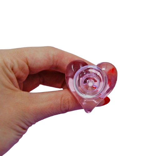 Hand holding a small pink and red smoking bowl piece for smoking pipe