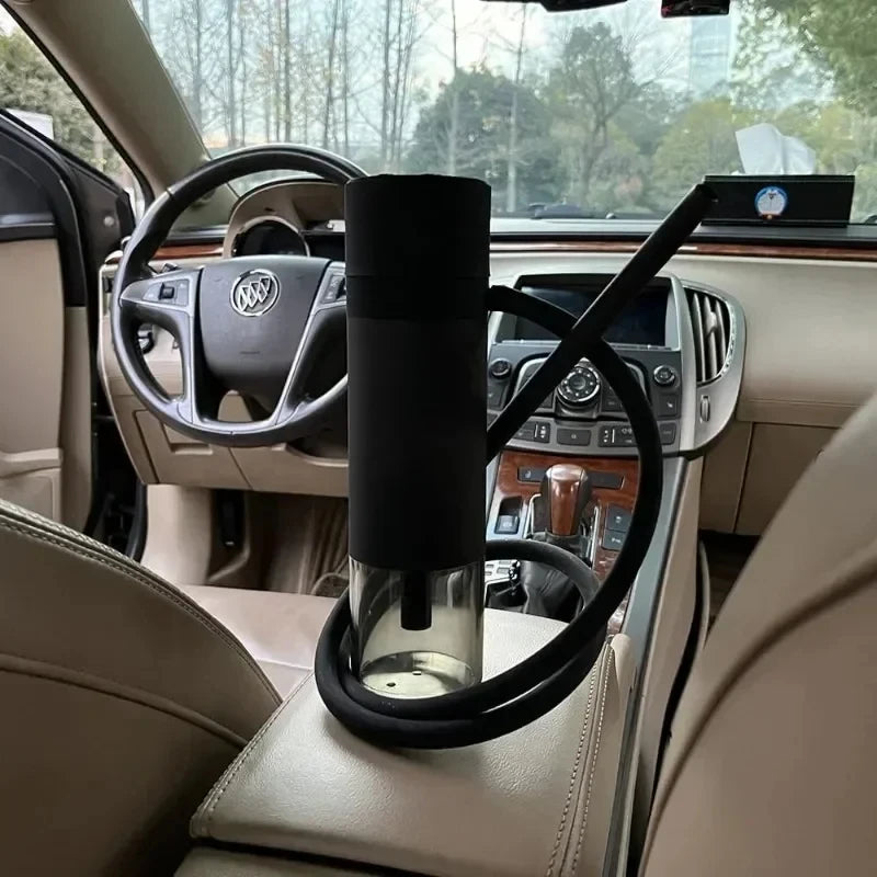 black portable hookah with black hose inside of car