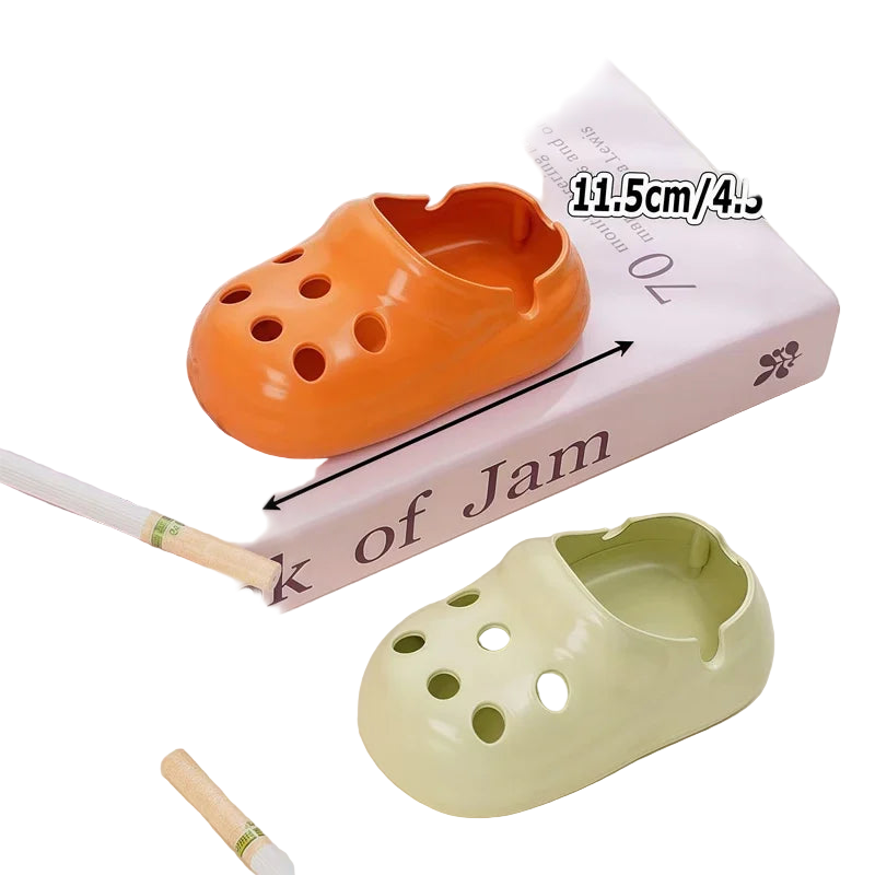 Two croc shoe-shaped containers, one orange and one green.