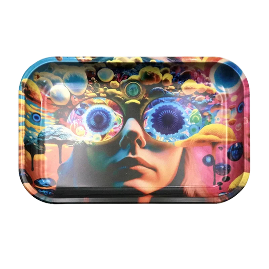 The image displays a large, rectangular metal smoke rolling tray with a colorful artistic depiction on the lid, featuring abstract faces and nature elements in a vibrant palette. The tray is designed with practical functionalities, such as a groove around the edge to hold papers or rolls.