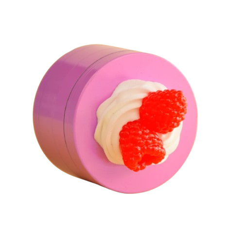 Pink herb grinder with a dessert-like design on a white background
