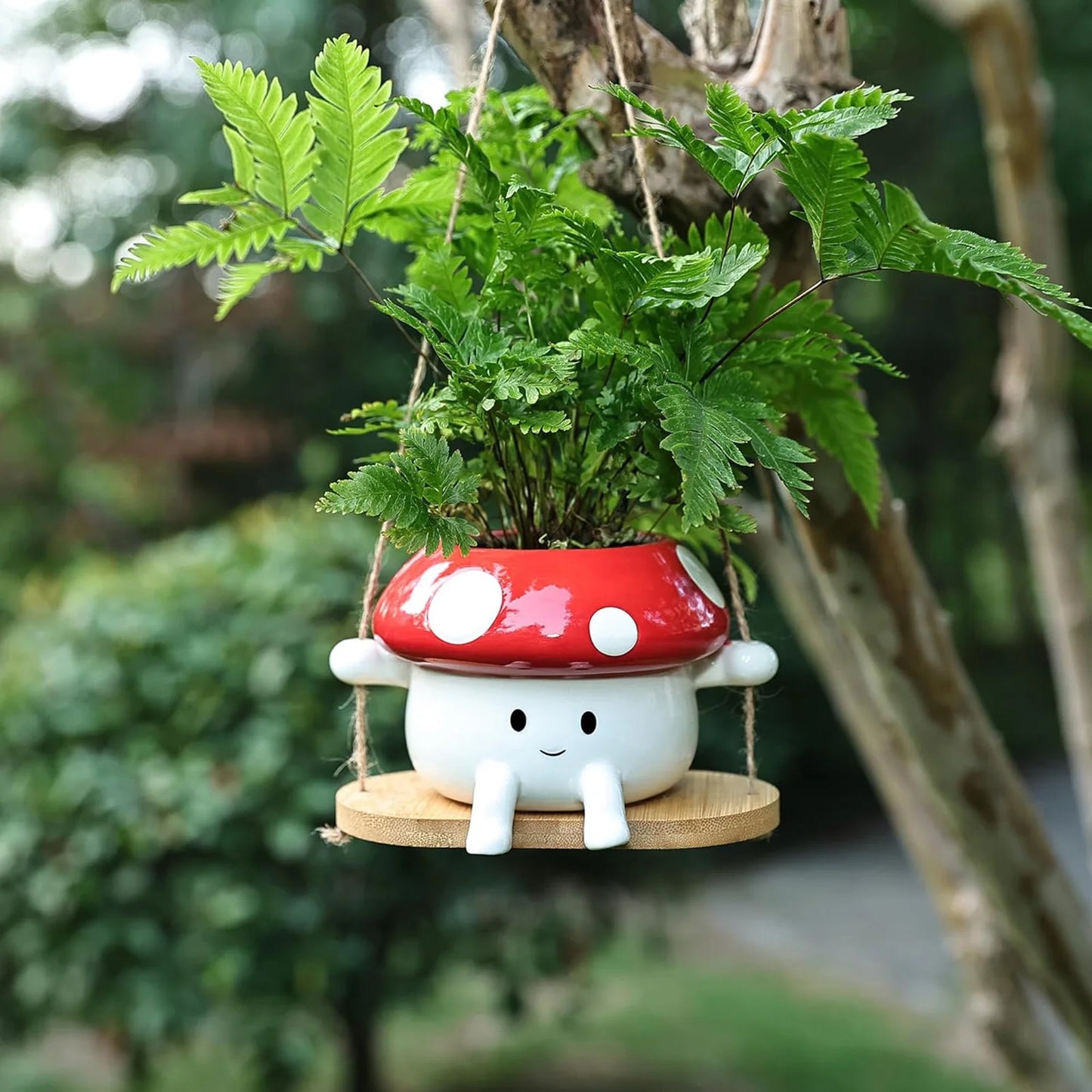 Mushroom-shaped plant pot with a green plant on a blurred natural background