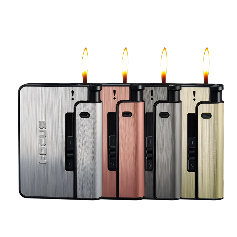 A collection of TorchPack cigarette cases in various colors, displayed horizontally with lit candles on top of each case.