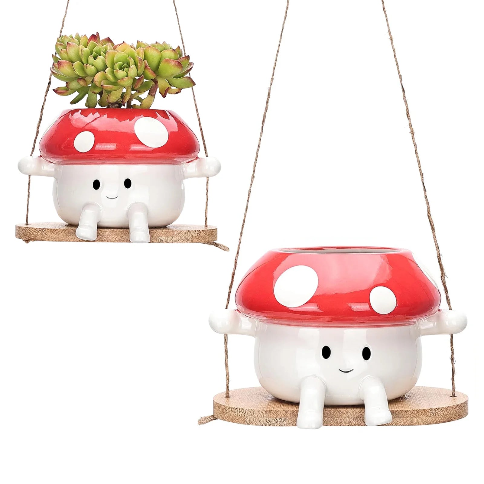 Two mushroom-shaped planters with red caps and white bodies on a white background